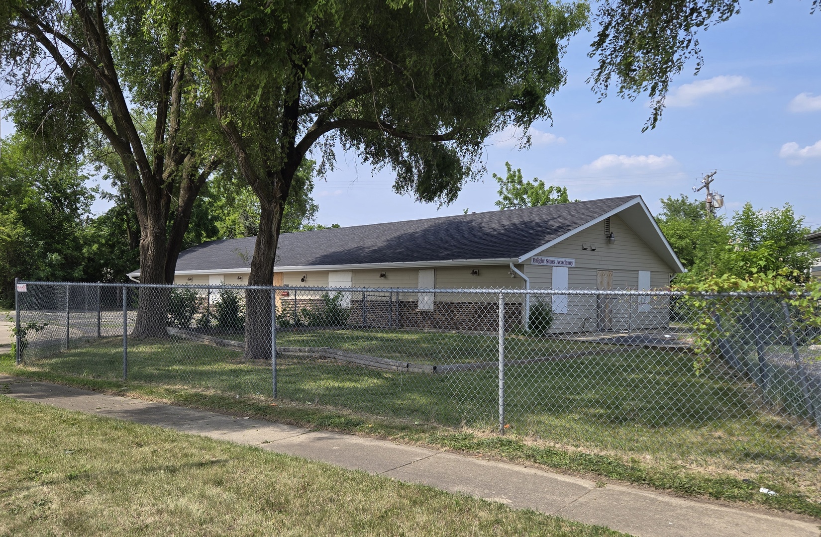 a house that has a tree in front of it