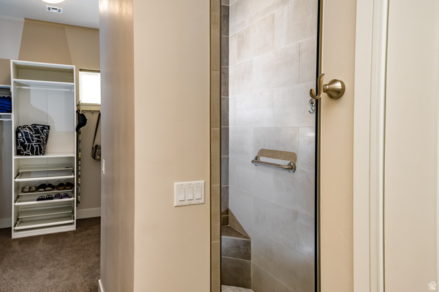 1283 North Gallen Road Santa Clara, UT 84765 - Photo 32 of 103 Primary Bathroom featuring a spacious walk-in closet