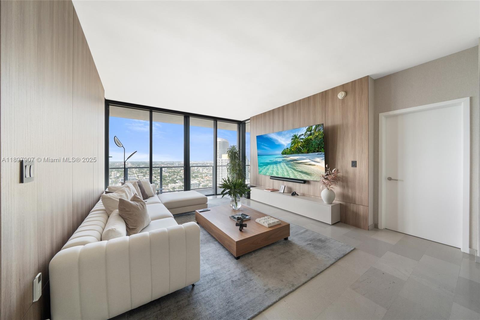 88 Southwest 7th Street, Unit 3910 Miami, FL 33130 - Photo 11 of 38 a living room with furniture and a large window