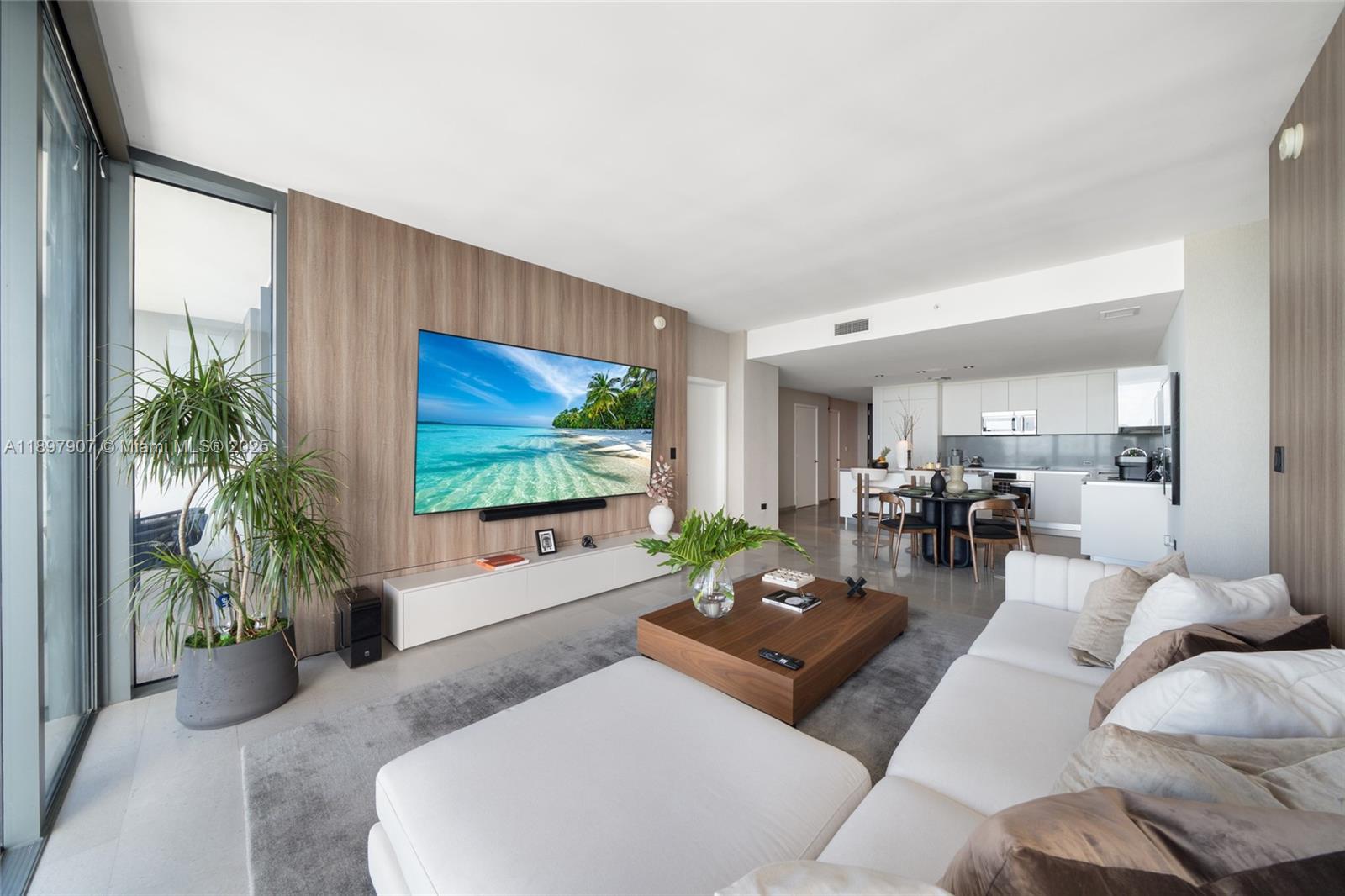 88 Southwest 7th Street, Unit 3910 Miami, FL 33130 - Photo 12 of 38 a living room with furniture and a flat screen tv