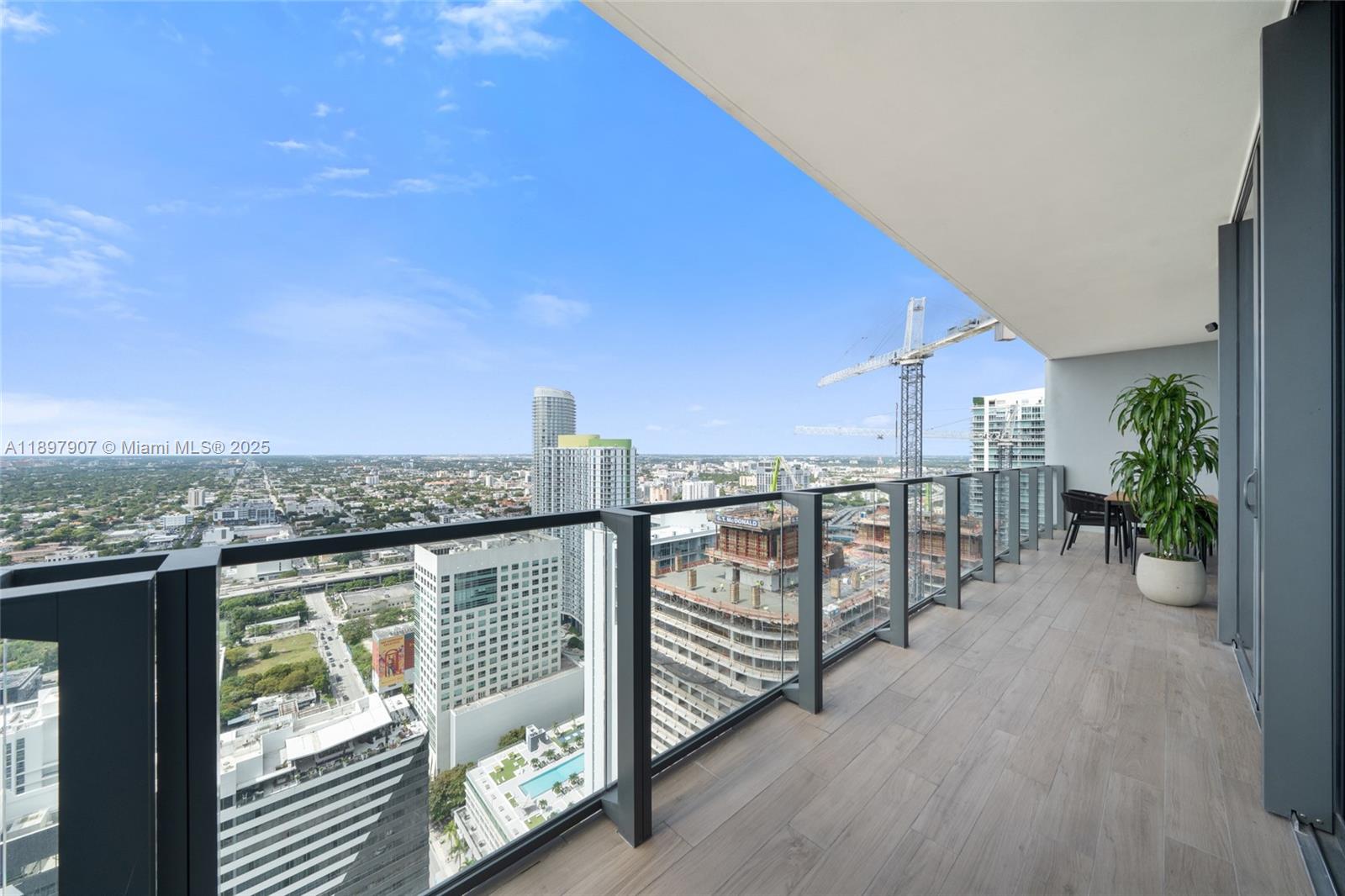 88 Southwest 7th Street, Unit 3910 Miami, FL 33130 - Photo 13 of 38 a view of a balcony with city view