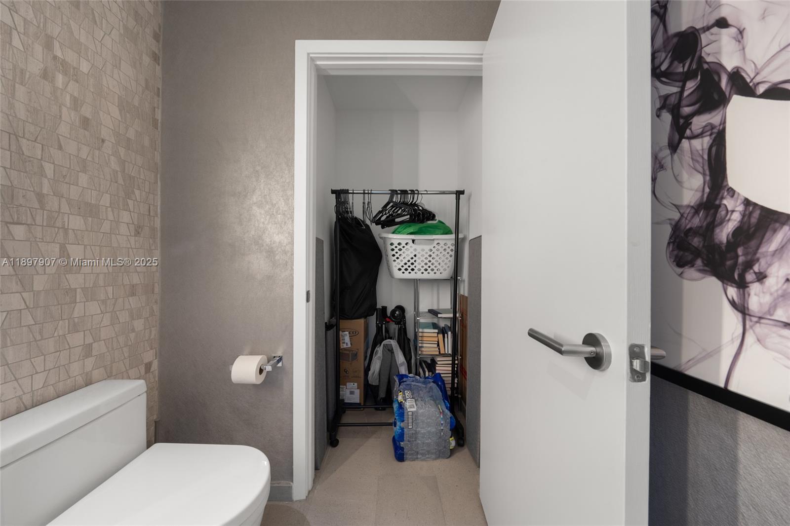 88 Southwest 7th Street, Unit 3910 Miami, FL 33130 - Photo 17 of 38 a bathroom with a toilet and a shower view