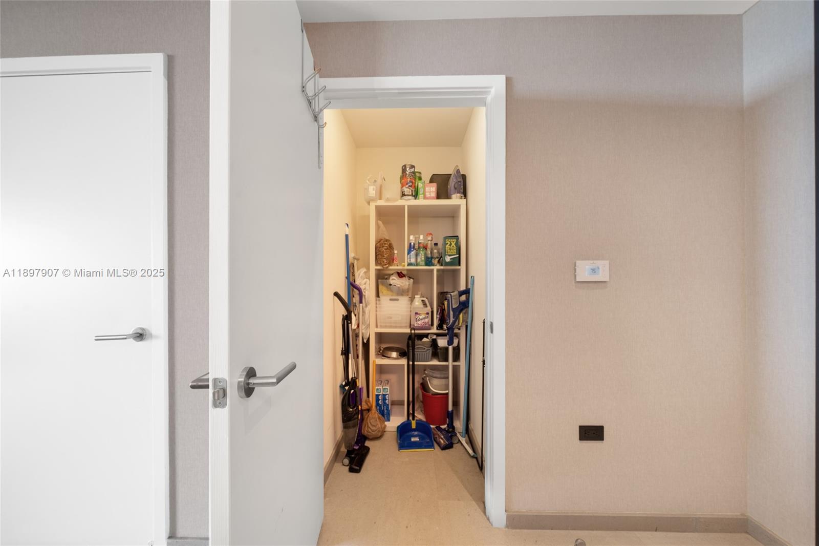 88 Southwest 7th Street, Unit 3910 Miami, FL 33130 - Photo 28 of 38 a view of a hallway with wooden shelves