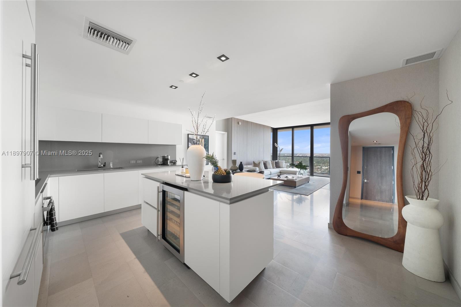 88 Southwest 7th Street, Unit 3910 Miami, FL 33130 - Photo 6 of 38 a kitchen with a sink stove and cabinets