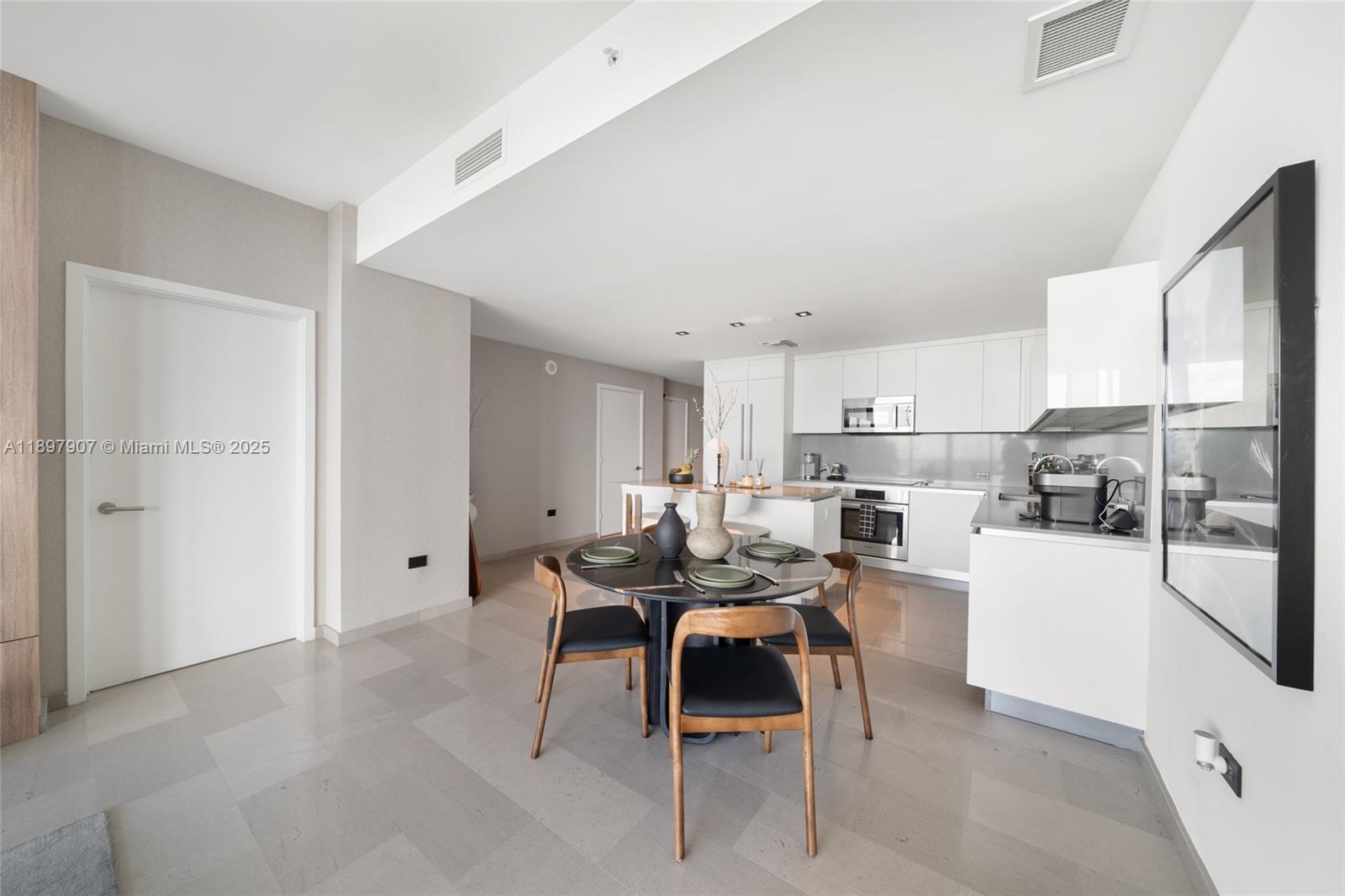 88 Southwest 7th Street, Unit 3910 Miami, FL 33130 - Photo 8 of 38 a living room with stainless steel appliances kitchen island granite countertop furniture and a refrigerator