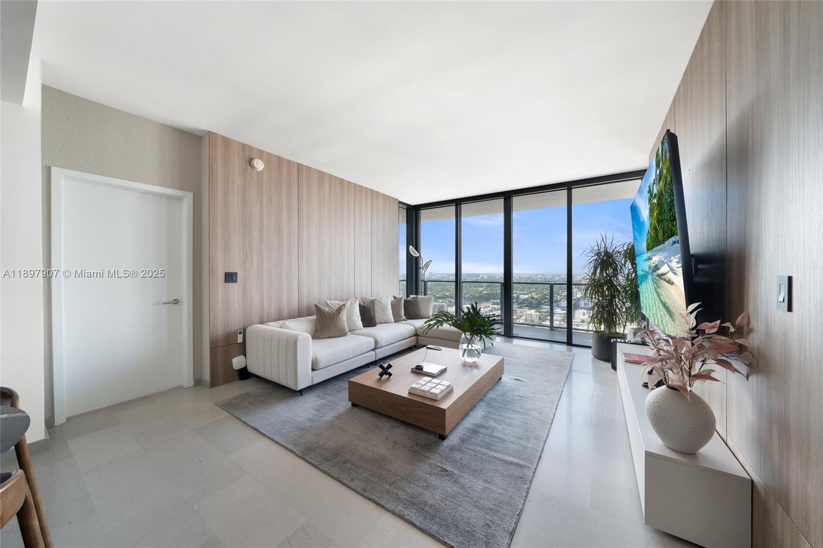 88 Southwest 7th Street, Unit 3910 Miami, FL 33130 - Photo 10 of 38 a living room with furniture and a large window