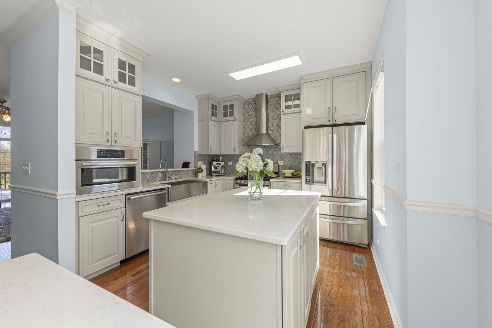 341 North Commerce Street Aurora, IL 60504 - Photo 5 of 26 a kitchen with stainless steel appliances a refrigerator and a stove top oven