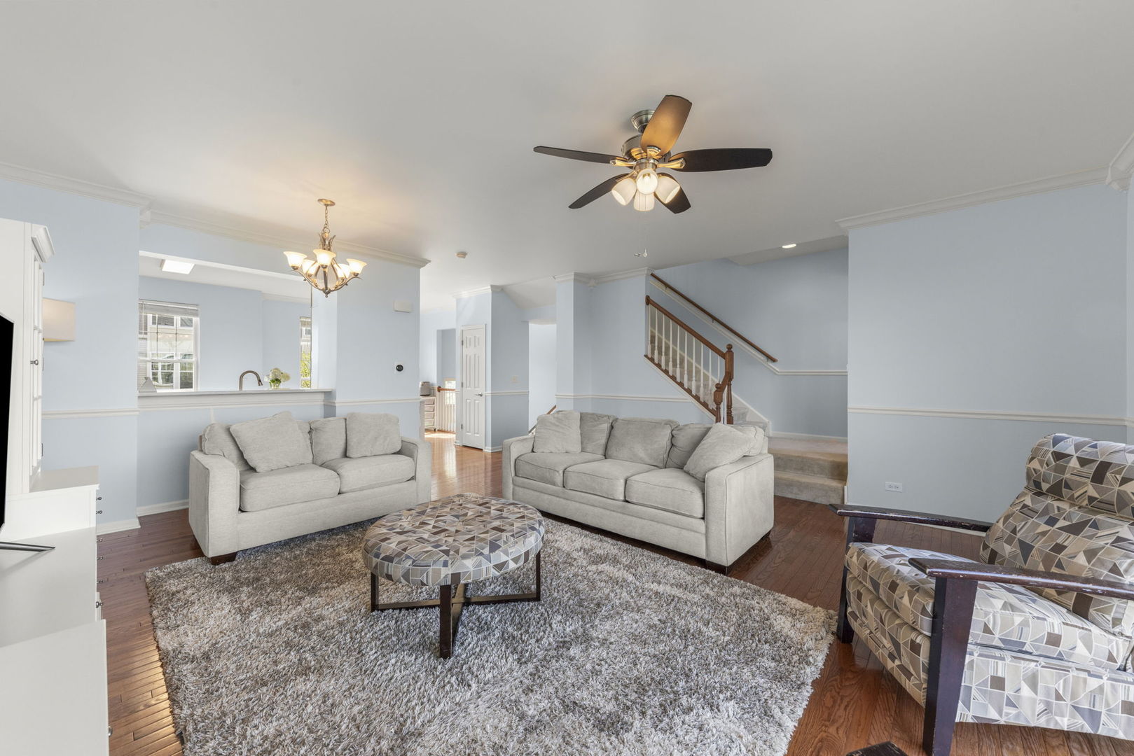 341 North Commerce Street Aurora, IL 60504 - Photo 6 of 26 a living room with furniture and a chandelier