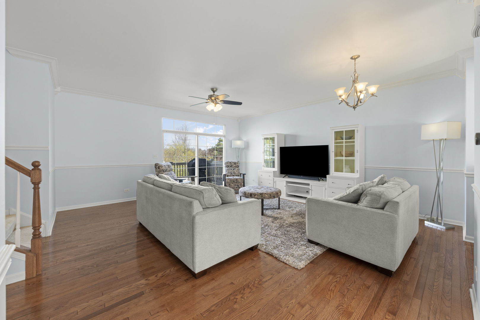 341 North Commerce Street Aurora, IL 60504 - Photo 8 of 26 a living room with furniture and a flat screen tv