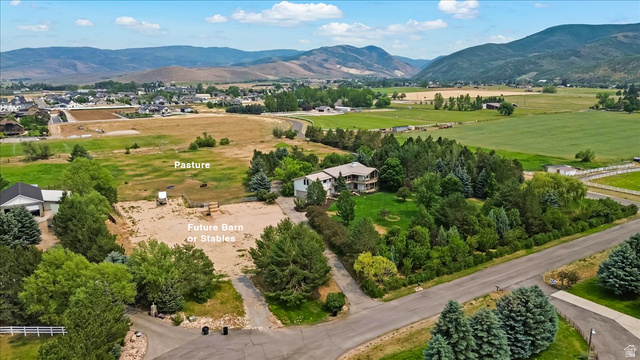 481 East Teancum Road Heber City, UT 84032 - Photo 79 of 89 Expansive property featuring a large residence, surrounding mature trees, and substantial open land