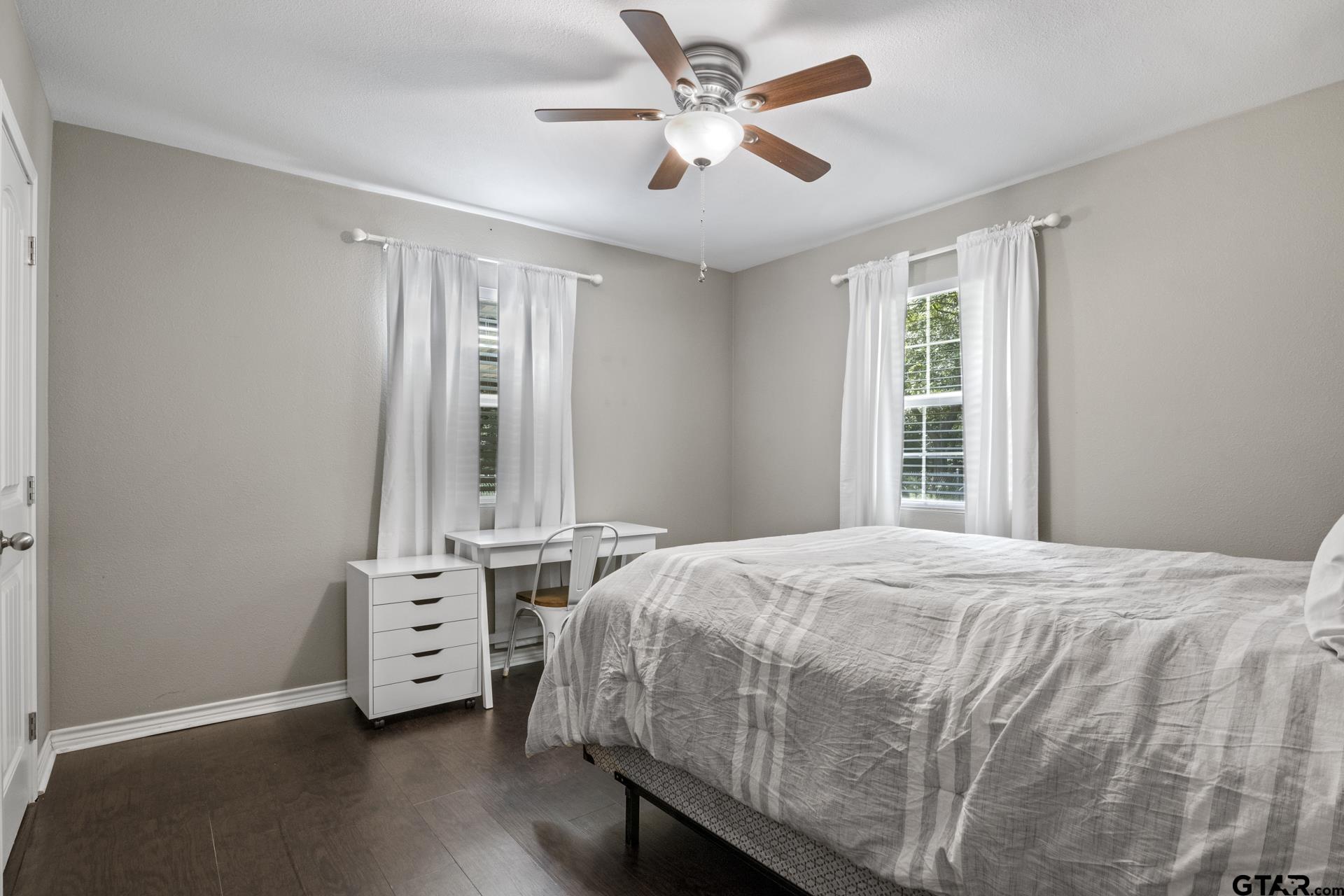 655 Daingerfield Street Pittsburg, TX 75686 - Photo 16 of 27 a bedroom with a bed and a window