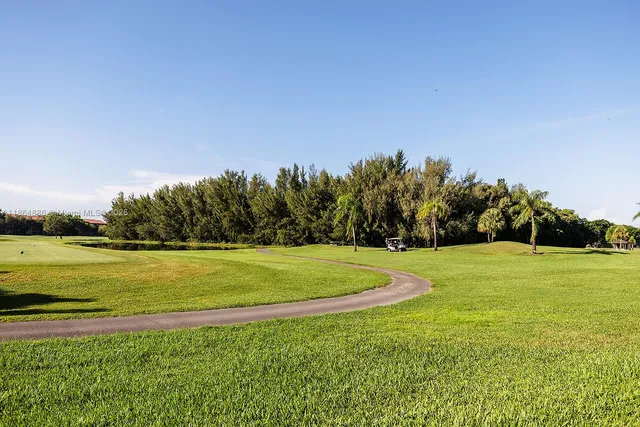 a view of a golf course with a lake