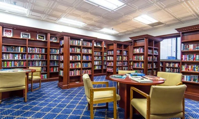 a reading room with furniture and wooden floor