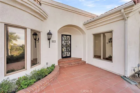 a view of staircase with a large window and a fireplace