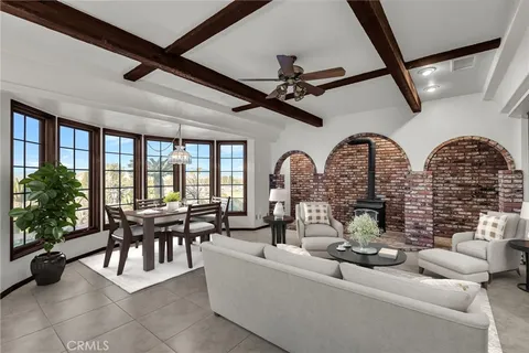 a dining room with a wooden table and chairs