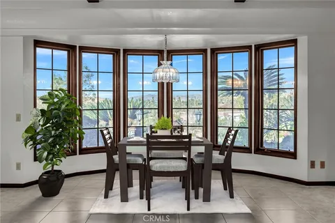 a kitchen with stainless steel appliances granite countertop a sink dishwasher stove and refrigerator with wooden floor