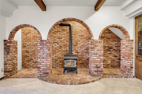 a kitchen with granite countertop a sink stove and refrigerator