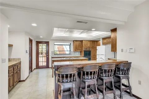a kitchen with a stove sink and cabinets