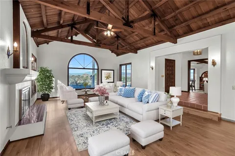 a view of staircase with railing and white walls