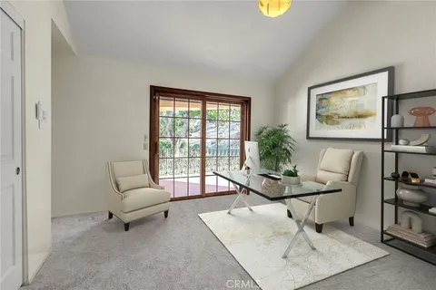 a view of a patio with couches table and chairs and potted plants