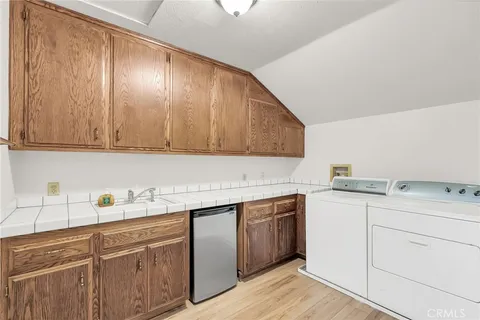 a view of a house with basketball court