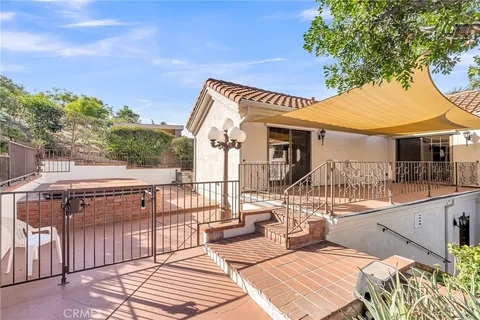 a view of backyard with outdoor seating and green space