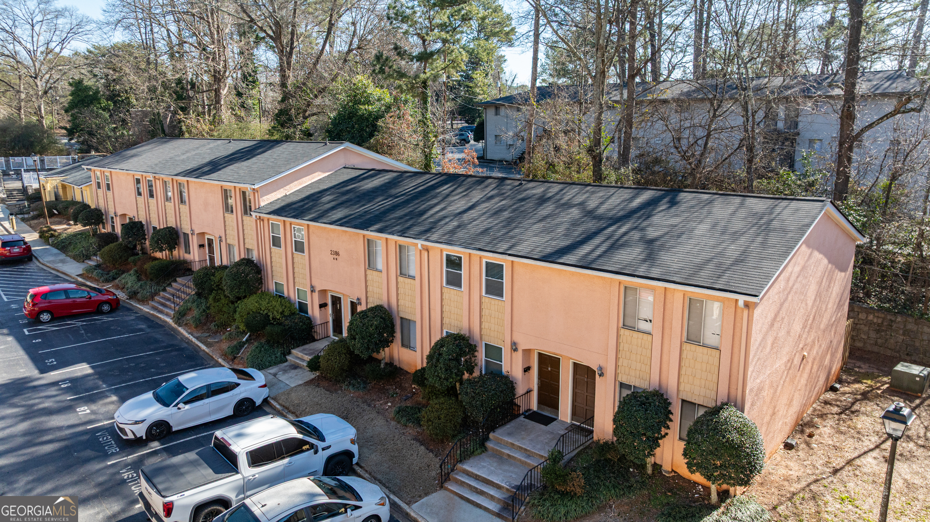 a view of a backyard with sitting area