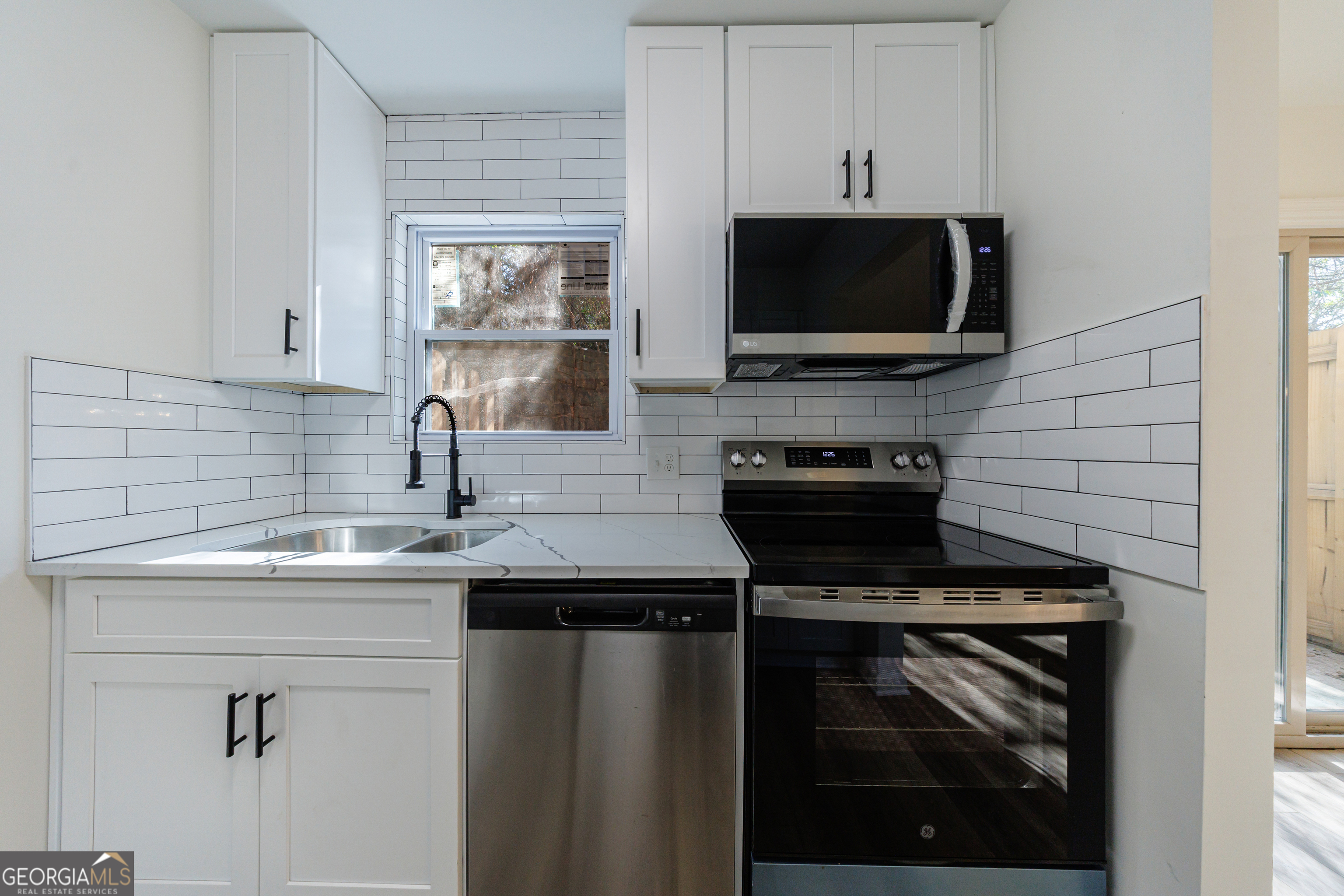 2386 Lawrenceville Highway Decatur, GA 30033 - Photo 20 of 55 a kitchen with a sink and a microwave