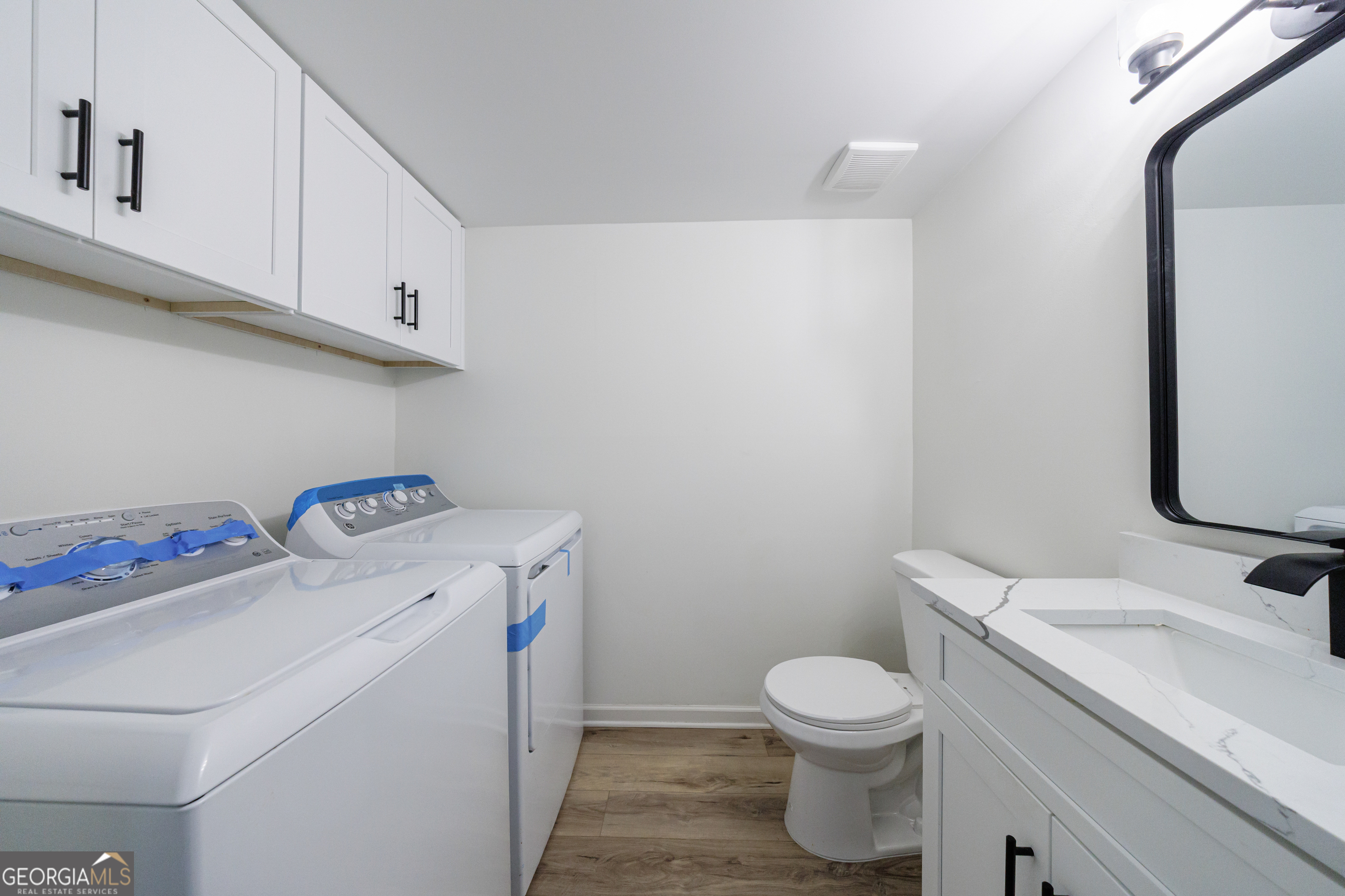 2386 Lawrenceville Highway Decatur, GA 30033 - Photo 22 of 55 a bathroom with a granite countertop toilet sink and mirror