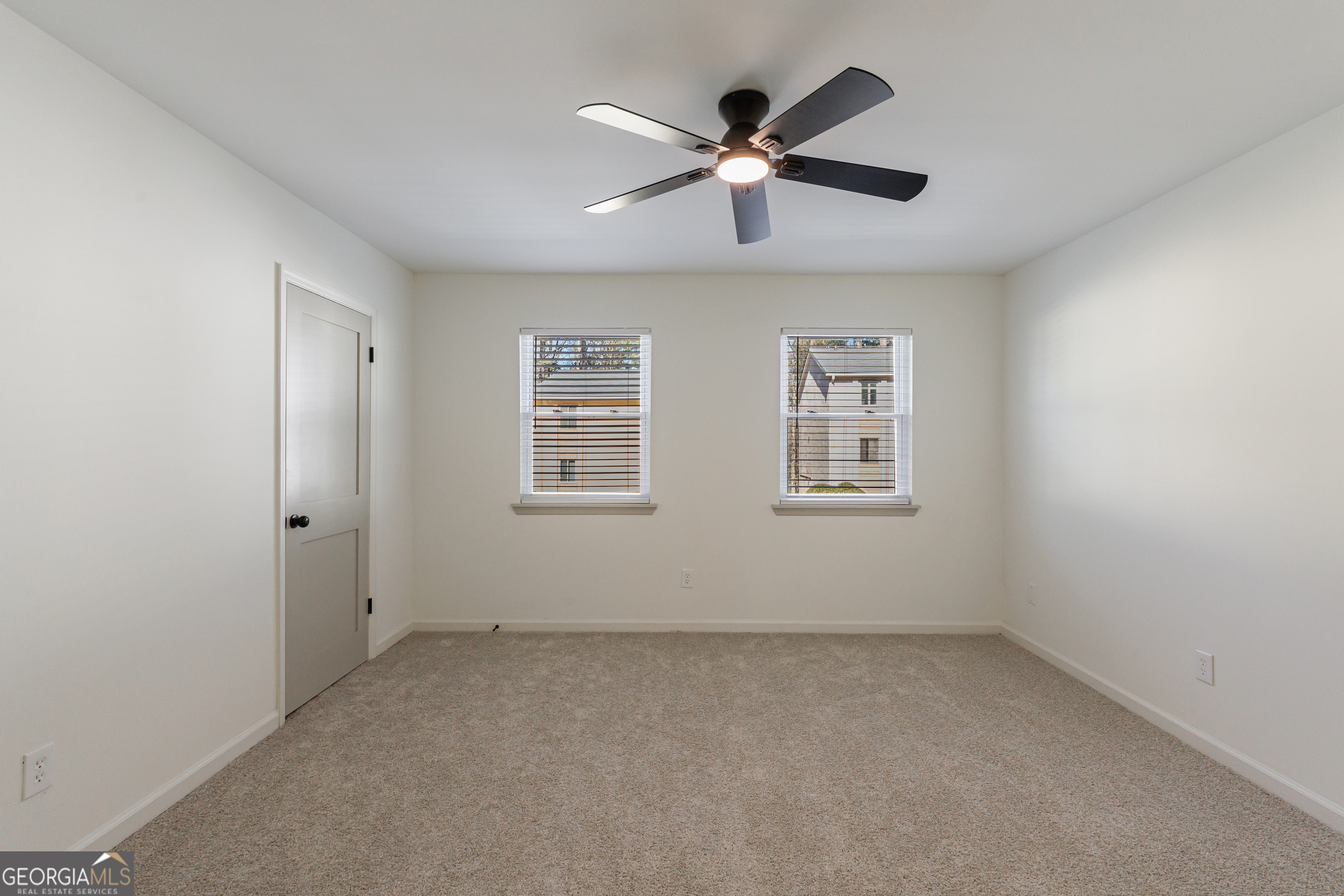 2386 Lawrenceville Highway Decatur, GA 30033 - Photo 24 of 55 an empty room with windows and ceiling fan
