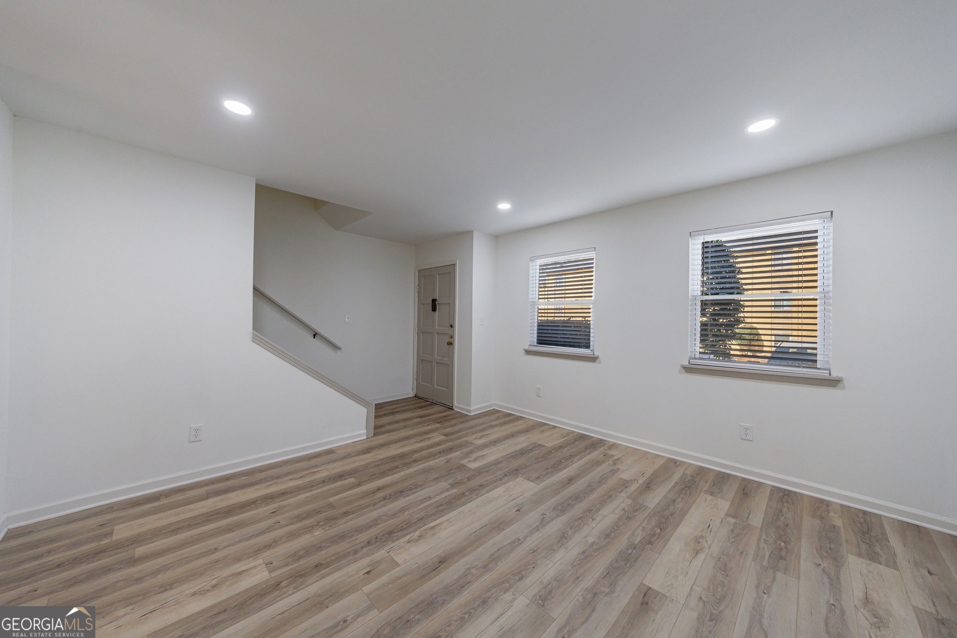 2386 Lawrenceville Highway Decatur, GA 30033 - Photo 9 of 55 a view of an empty room with wooden floor and a window