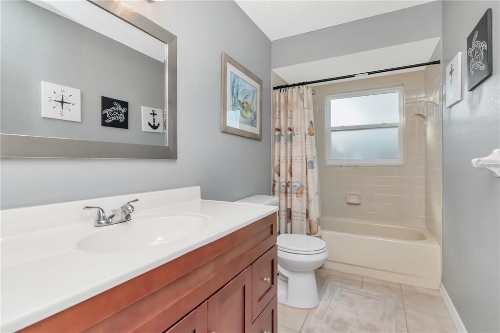 9791 Horizon Drive Spring Hill, FL 34608 - Photo 22 of 38 a bathroom with a sink a toilet and shower