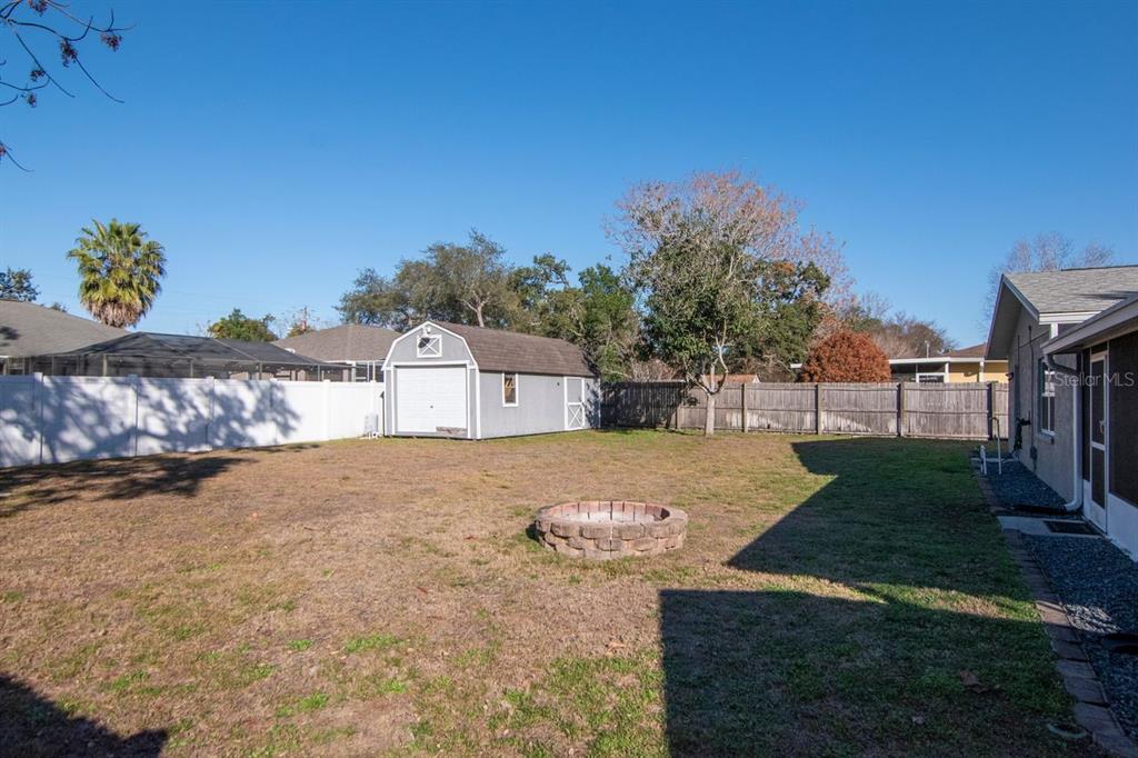 9791 Horizon Drive Spring Hill, FL 34608 - Photo 31 of 38 a front view of a house with a yard and garage