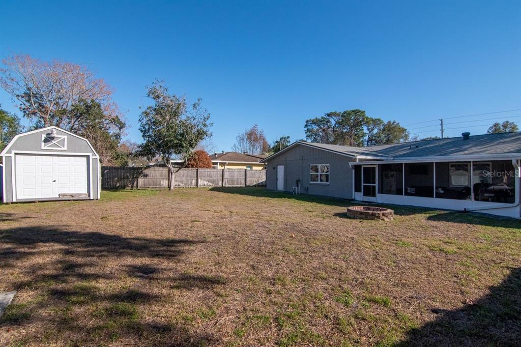 9791 Horizon Drive Spring Hill, FL 34608 - Photo 32 of 38 a front view of a house with a garden