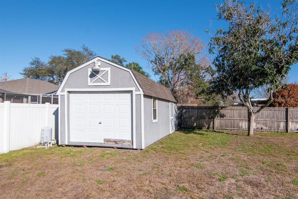 9791 Horizon Drive Spring Hill, FL 34608 - Photo 34 of 38 a front view of a house with a yard and garage