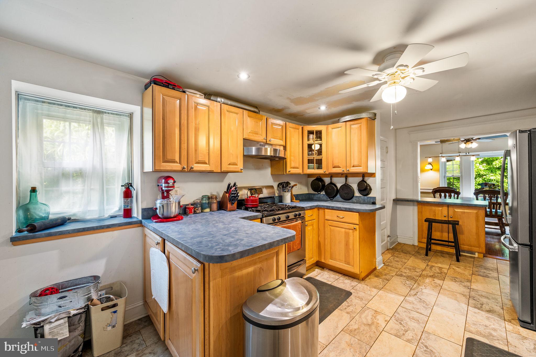 408 East Woodlawn Street Philadelphia, PA 19144 - Photo 11 of 31 a kitchen with a stove a sink and a refrigerator