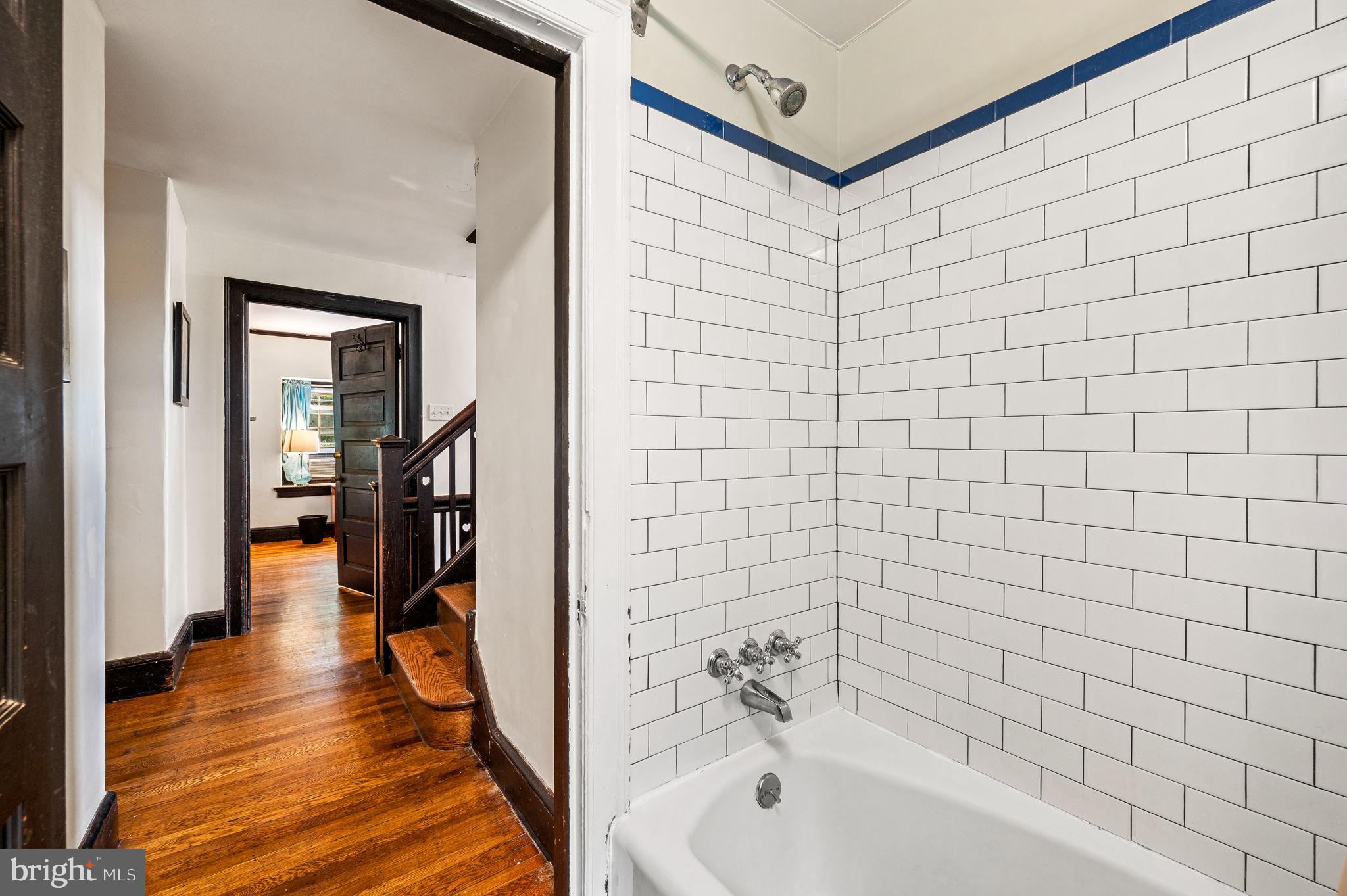 408 East Woodlawn Street Philadelphia, PA 19144 - Photo 19 of 31 a bathroom with a bathtub and a shower