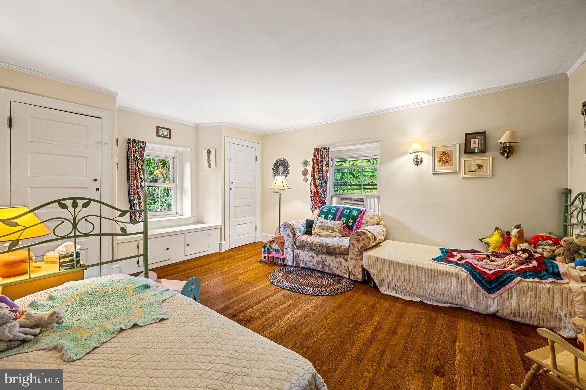 408 East Woodlawn Street Philadelphia, PA 19144 - Photo 21 of 31 a bedroom with furniture and a window