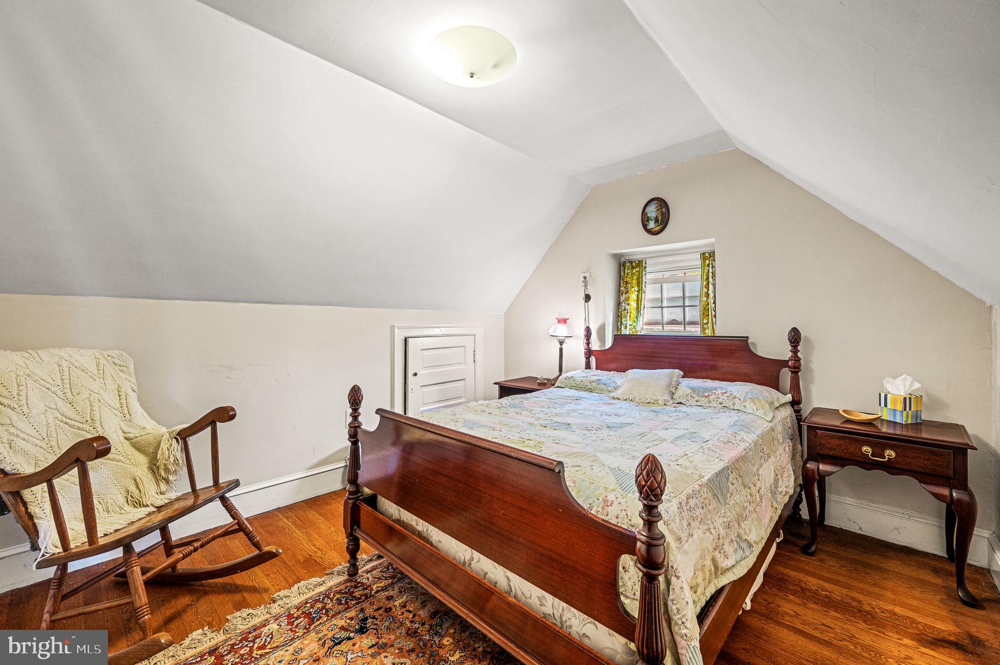 408 East Woodlawn Street Philadelphia, PA 19144 - Photo 24 of 31 a bedroom with a bed a dresser and chair