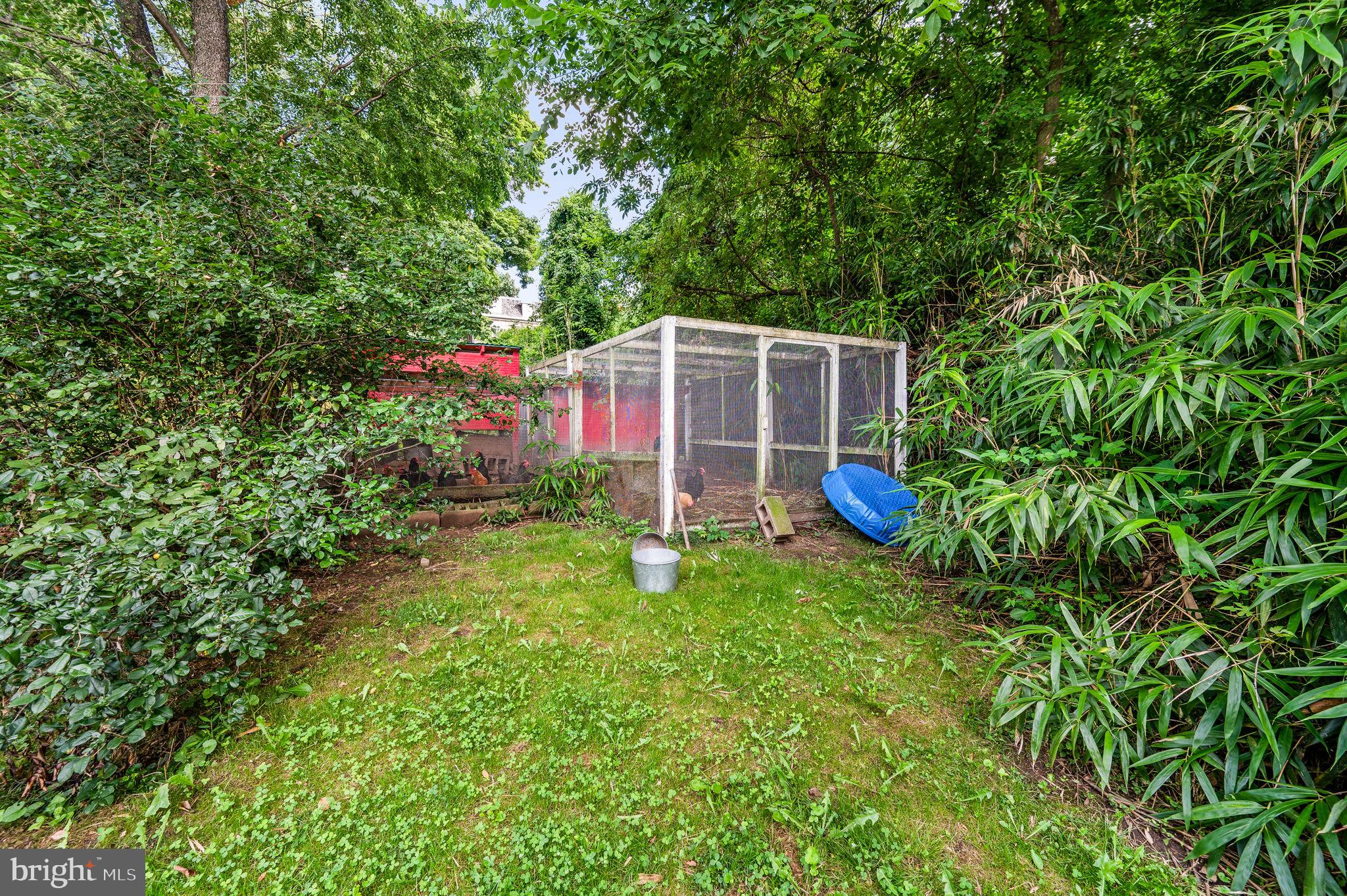 408 East Woodlawn Street Philadelphia, PA 19144 - Photo 28 of 31 a backyard of a house with table and chairs
