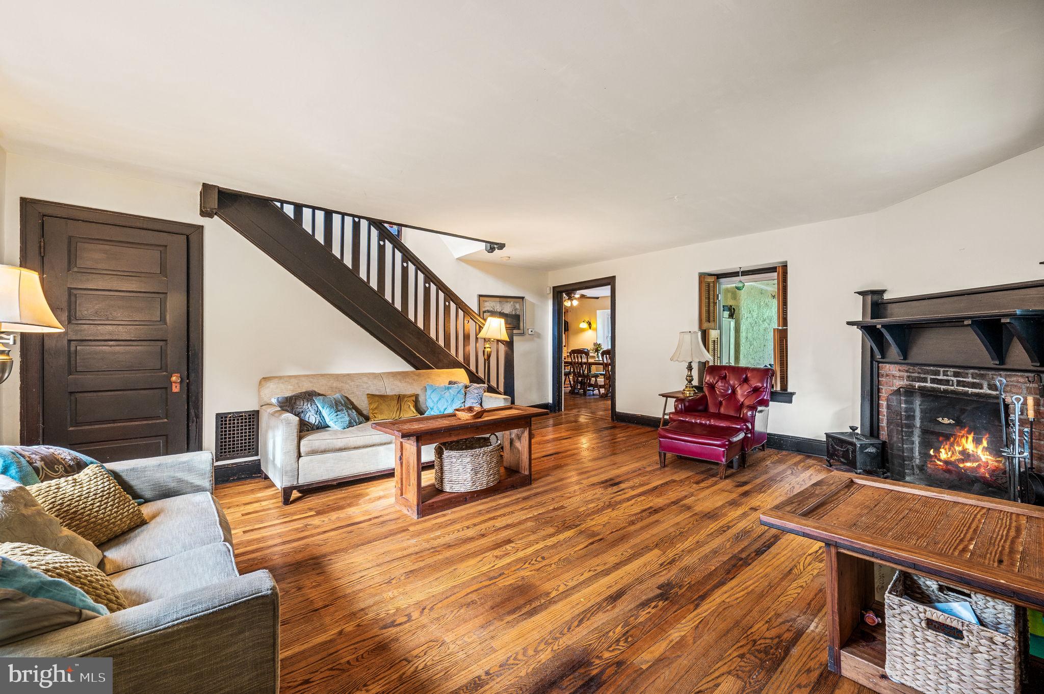408 East Woodlawn Street Philadelphia, PA 19144 - Photo 6 of 31 a living room with furniture and a fireplace