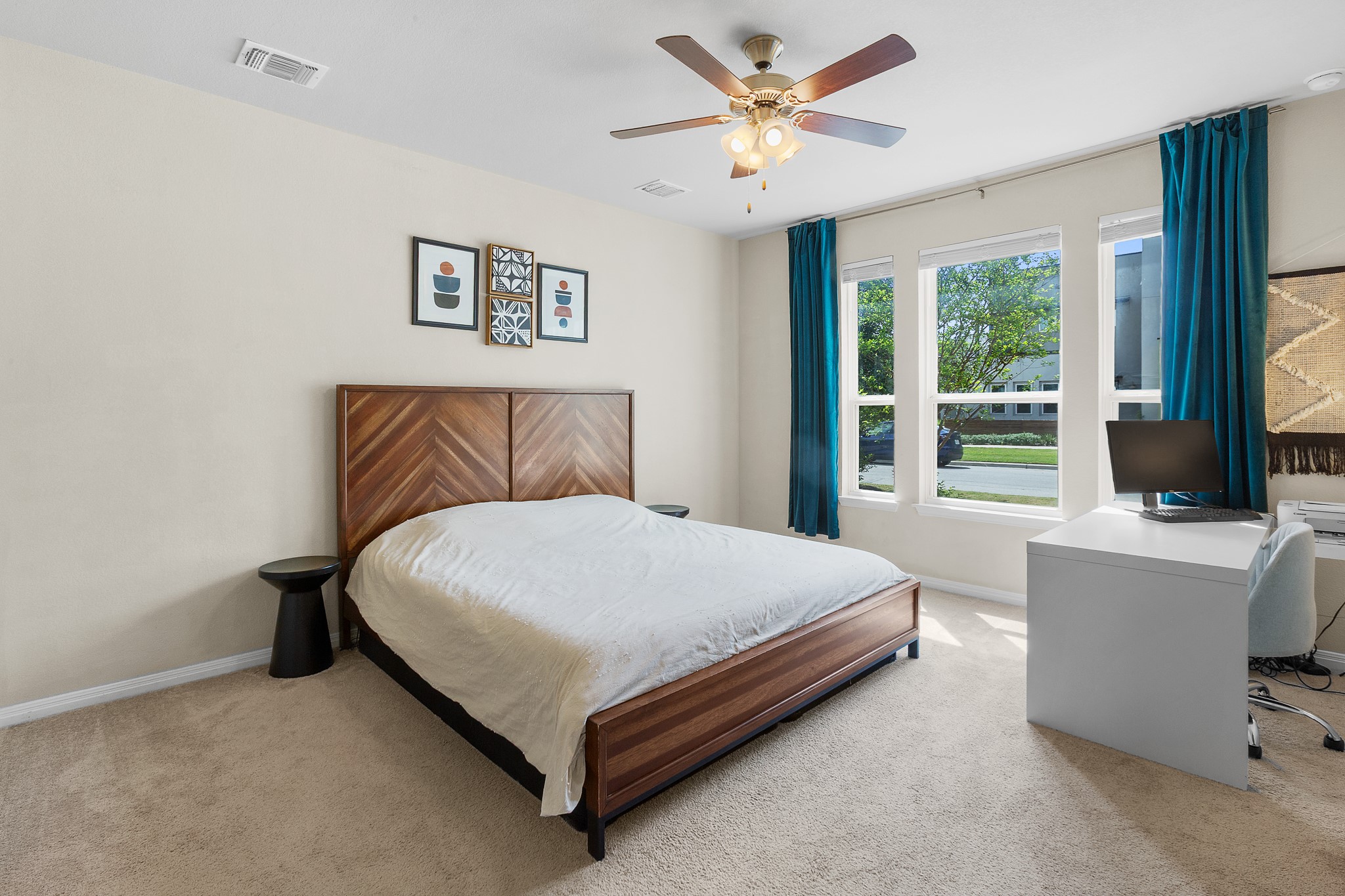 8916 Cattle Baron Path Austin, TX 78747 - Photo 14 of 37 a bed sitting in a bedroom next to a window