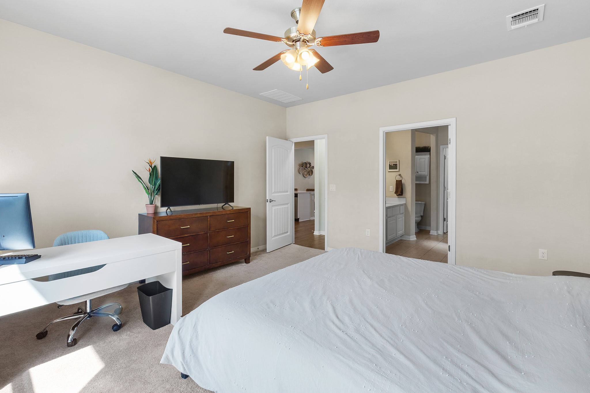 8916 Cattle Baron Path Austin, TX 78747 - Photo 15 of 37 a bedroom with a bed and a flat screen tv