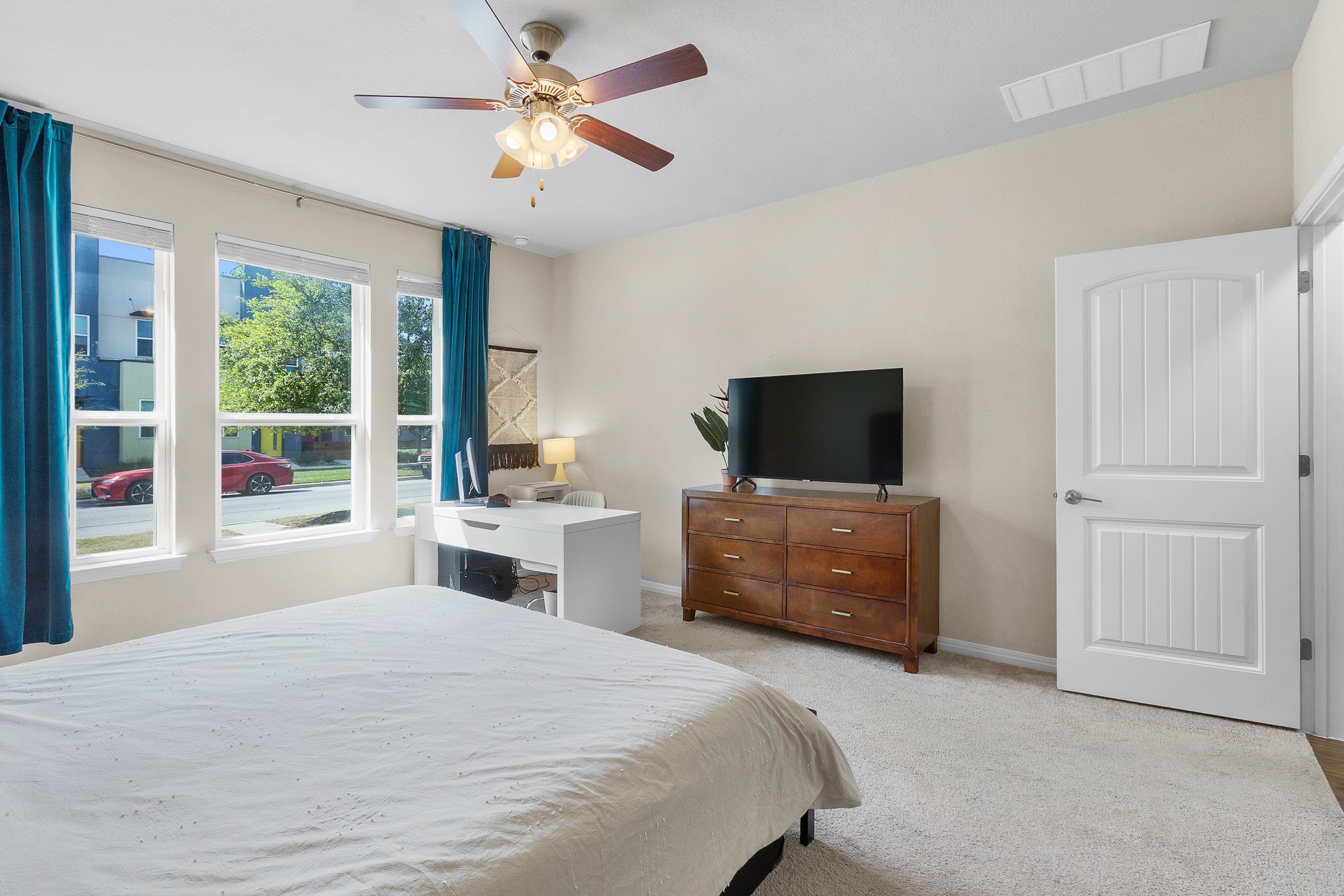 8916 Cattle Baron Path Austin, TX 78747 - Photo 16 of 37 a bedroom with a bed a window and a television