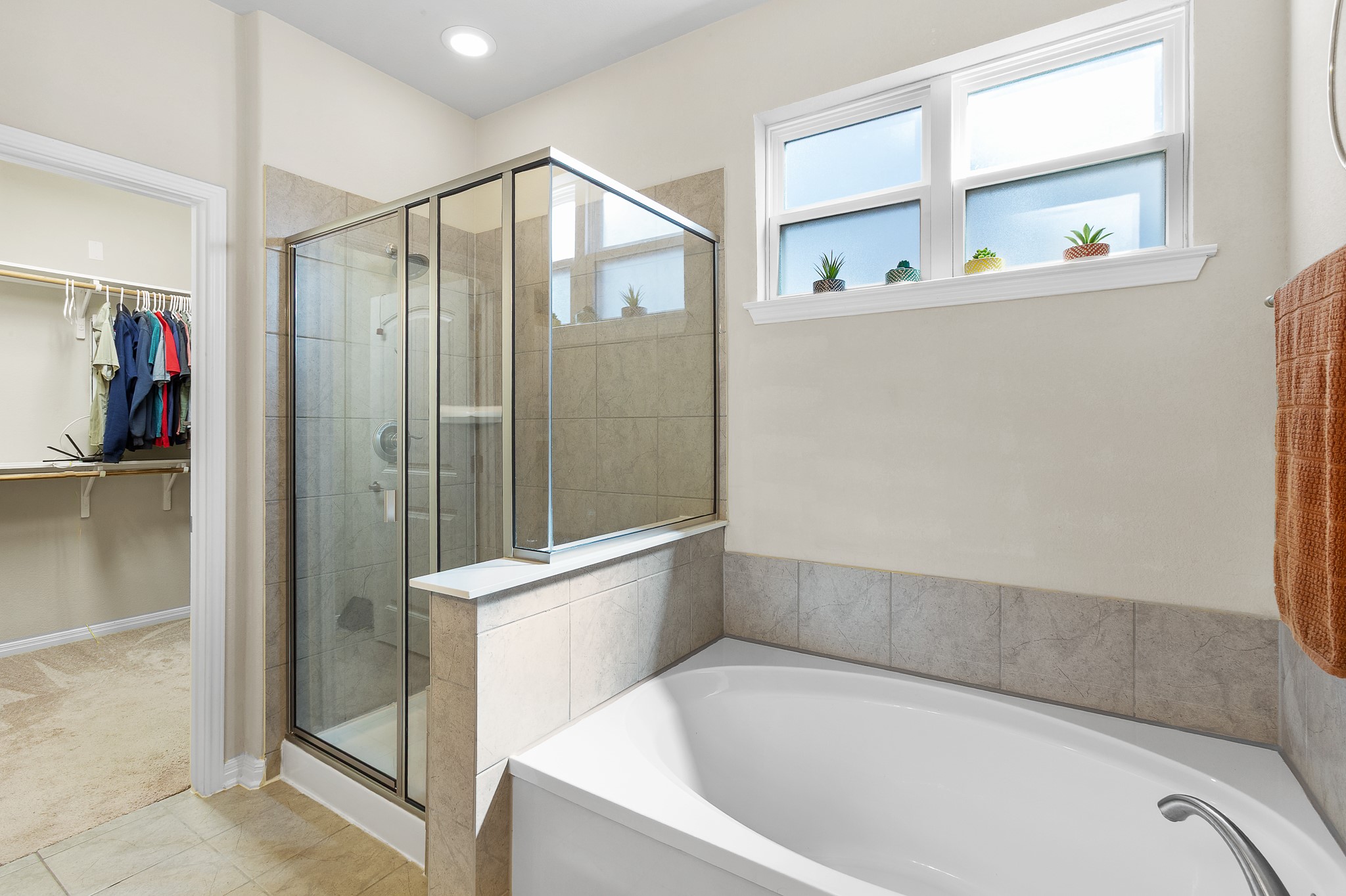 8916 Cattle Baron Path Austin, TX 78747 - Photo 18 of 37 a bathroom with a bathtub and a shower