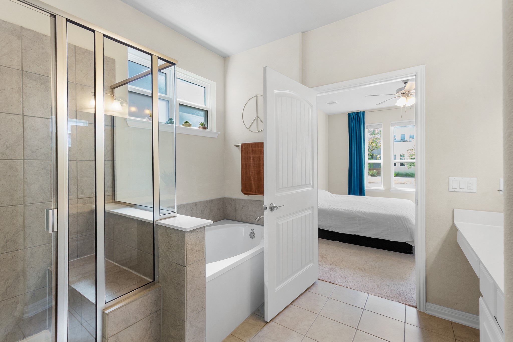 8916 Cattle Baron Path Austin, TX 78747 - Photo 20 of 37 a living room with furniture and a glass door shower