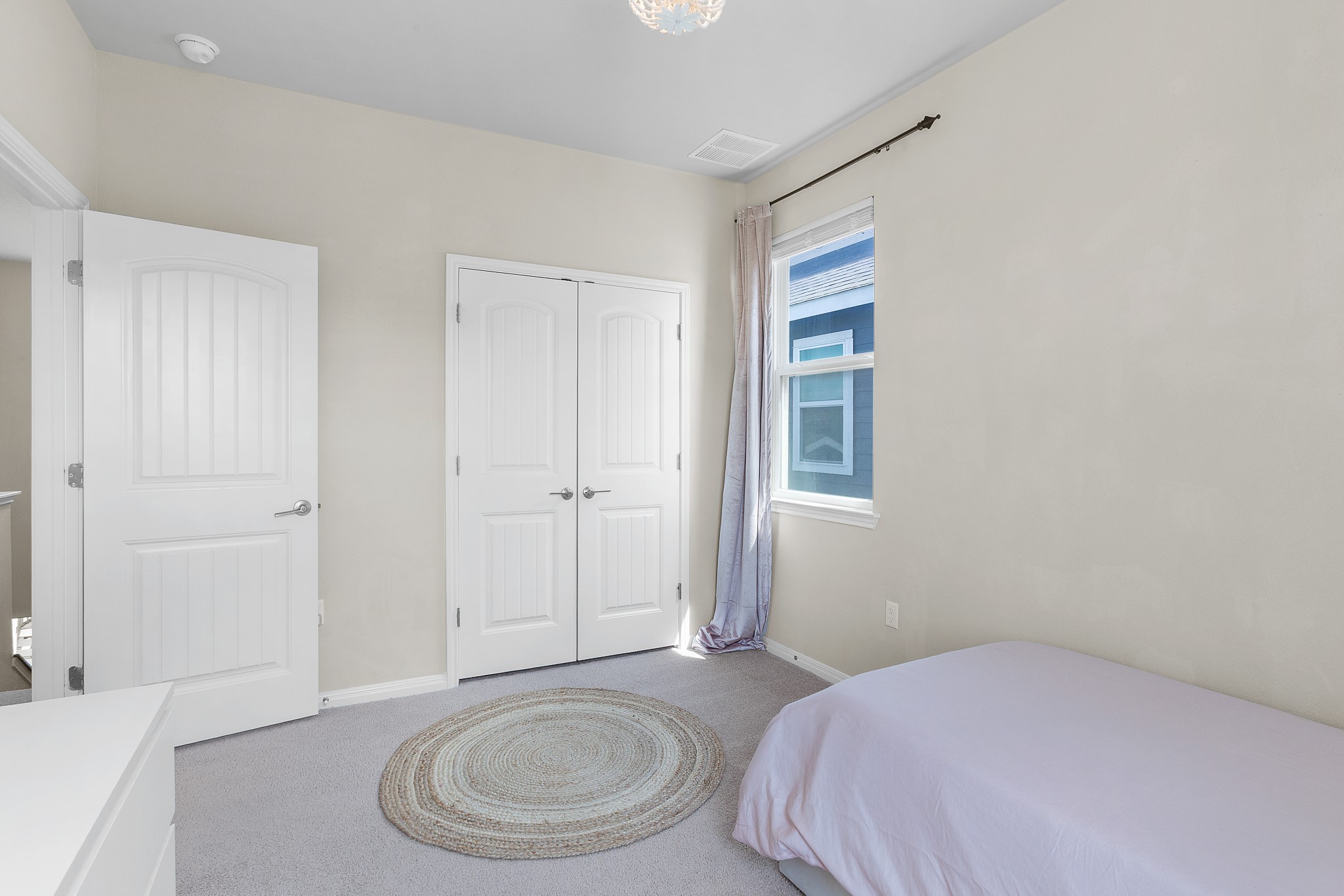 8916 Cattle Baron Path Austin, TX 78747 - Photo 27 of 37 a bedroom with a bed and a dresser