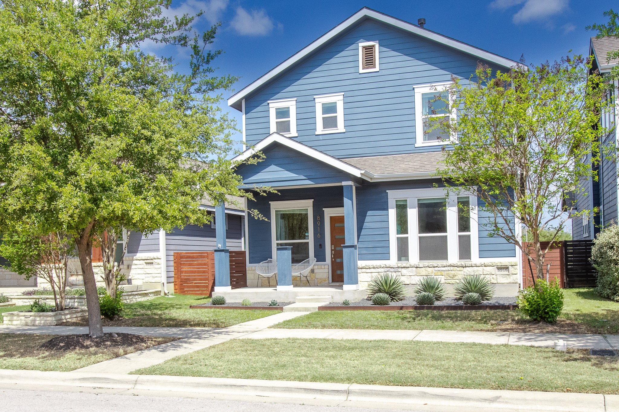 8916 Cattle Baron Path Austin, TX 78747 - Photo 3 of 37 a front view of a house with a yard