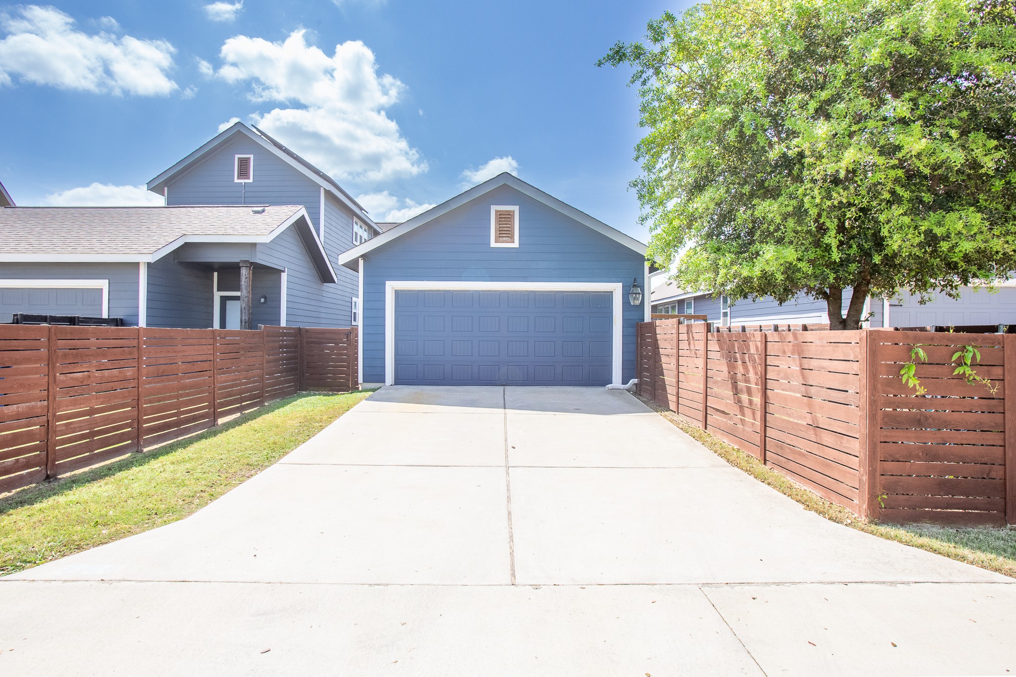 8916 Cattle Baron Path Austin, TX 78747 - Photo 35 of 37 a front view of a house with a garage