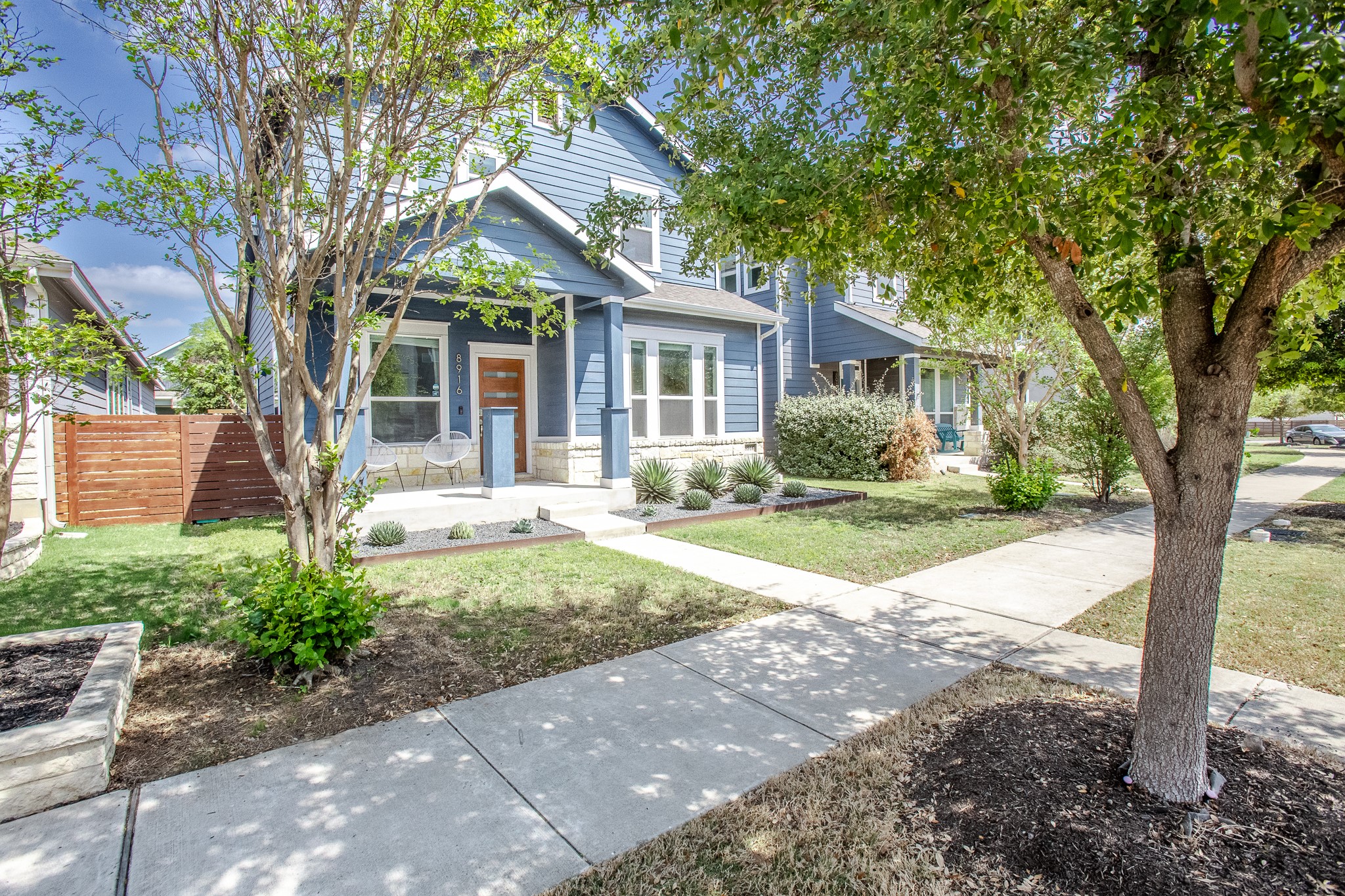 8916 Cattle Baron Path Austin, TX 78747 - Photo 4 of 37 a view of a house with yard and tree s